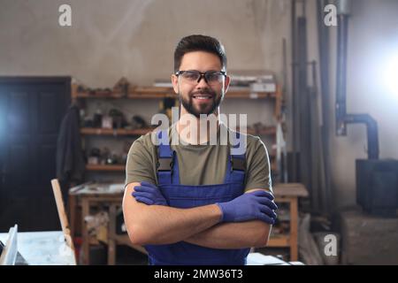 Portrait of professional male carpenter in workshop Stock Photo