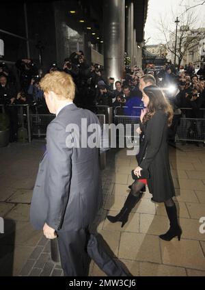 Soon to be wed couple Prince William and Kate Middleton arrive at and later leave the New Zealand High Commission with Prince Harry where they signed a book of condolences to honor those who died in the Christchurch earthquake.  The couple made their stop after arriving back in London from their trip to St Andrews University, where they originally met, in Scotland where they celebrated the school's 600th anniversary celebrations. London, UK. 02/25/11. Stock Photo