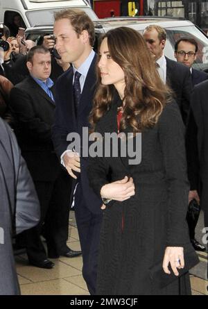 Soon to be wed couple Prince William and Kate Middleton arrive at and later leave the New Zealand High Commission with Prince Harry where they signed a book of condolences to honor those who died in the Christchurch earthquake.  The couple made their stop after arriving back in London from their trip to St Andrews University, where they originally met, in Scotland where they celebrated the school's 600th anniversary celebrations. London, UK. 02/25/11. Stock Photo