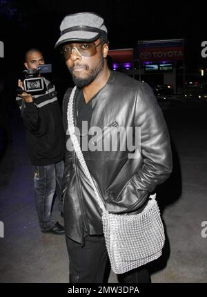 Hip hop and R&B musician will.i.am (aka William James Adams, Jr.) of The Black Eyed Peas arrives at the Staples Center to watch the LA Lakers vs. the New Jersey Nets basketball game where the Lakers beat the Nets 100-88.  The I Gotta Feeling singer showed off his diamond ring and his silver satchel that appeared to be made of pop can tabs. Los Angeles, CA. 01/14/11. Stock Photo