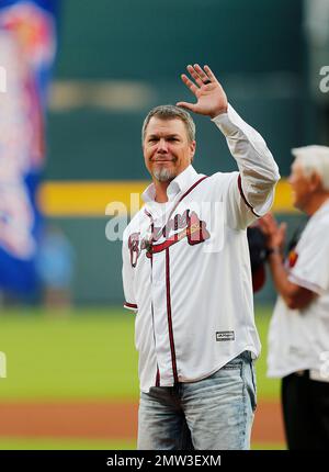 Former Atlanta Braves' Chipper Jones, seated center, is joined by