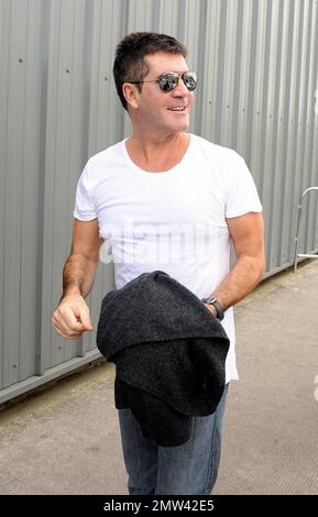 'X-Factor' judges Simon Cowell, Cheryl Cole, Louis Walsh and Dannii Minogue's current stand-in Geri Halliwell arrive at the SECC for the first day of auditions for the 2010 series of the show. Glasgow, Scotland. 6/9/10. . Stock Photo