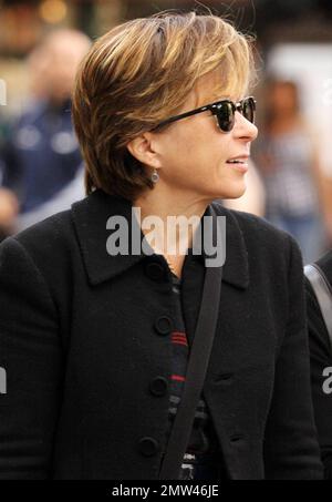 EXCLUSIVE!! Actress Yeardley Smith, voice of Lisa Simpson on the long running TV series 'The Simpsons', wears trendy horn-rimmed sunglasses and a plaid skirt at The Grove where she walked with a friend and appeared a bit shy.  Yeardley is currently working on the 22nd season of 'The Simpsons'. Los Angeles, CA. 11/24/10. Stock Photo