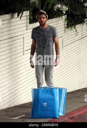 Exclusive!! Actor Zachary Quinto was seen out and about this afternoon.  The 'Star Trek' actor dressed in jeans, flip flops, a t-shirt with zebras and his trademark fedora as he ran some errands before heading to a lunch meeting in West Hollywood. Los Angeles, CA.  5/9/09. Stock Photo