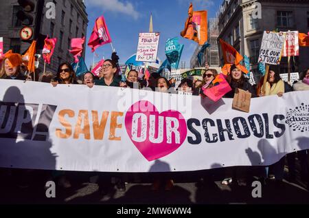 London, UK. 01st Feb, 2023. Dr Mary Bousted (third from left), joint general secretary of the National Education Union, holds a banner with other protesters which reads 'Save Our Schools' during the demonstration in Regent Street. Thousands of teachers and supporters marched in central London as teachers across the country begin their strike over pay. The day has seen around half a million people staging walkouts around the UK, including teachers, university staff, public service workers and train drivers. Credit: SOPA Images Limited/Alamy Live News Stock Photo