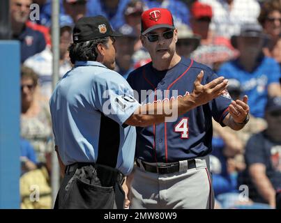 Toronto Blue Jays Paul Molitor, right, is greeted in the dugout as