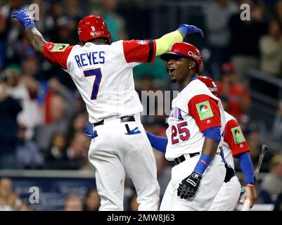 Dominican Republic's Jose Reyes, left, celebrates with teammate Nelson Cruz  their 9-0 victory over Panama at a World Baseball Classic game in San Juan,  Sunday, March 8, 2009. (AP Photo/Fernando Llano Stock