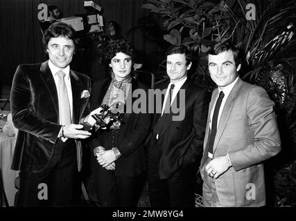 French singer Sacha Distel left hands a chicken to French