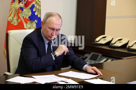 Novo-Ogaryovo, Russia. 01st Feb, 2023. Russian President Vladimir Putin chairs a teleconference to discuss rebuilding residential infrastructure in the captured Ukrainian territories of Donetsk and Luhansk, from the official residence of Novo-Ogaryovo, February 1, 2023 in Novo-Ogaryovo, Moscow Region, Russia. Credit: Mikhail Klimentyev/Kremlin Pool/Alamy Live News Stock Photo