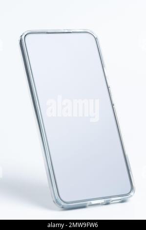 Smartphone in transparent cover in vertical view isolated Stock Photo