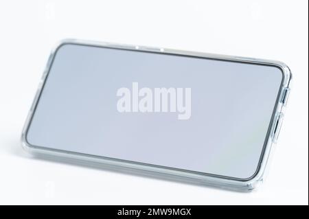 Smarphone in transparent cover on horizontal view isolated Stock Photo