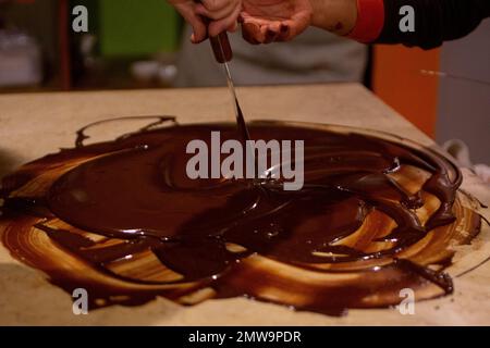 Mixing Chocolate for Tuffles by a chocolatier Stock Photo