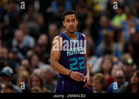 Charlotte Hornets guard Brian Roberts (22) releases a jump shot as  Minnesota Timberwolves guard Mo Williams (25) defends during second half  action on Monday, Jan. 19, 2015, at Time Warner Cable Arena