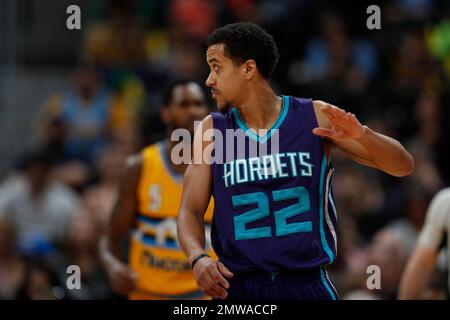 Charlotte Hornets guard Brian Roberts (22) releases a jump shot as  Minnesota Timberwolves guard Mo Williams (25) defends during second half  action on Monday, Jan. 19, 2015, at Time Warner Cable Arena