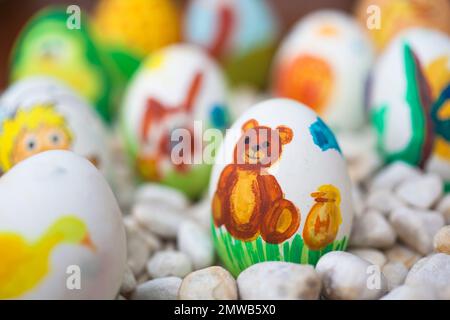 A selective focus of painted Easter eggs with different forms and animals Stock Photo