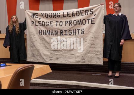 New York, New York, USA. 31st Jan, 2023. (NEW) International Mock Trial on Human Rights. January 31, 2023, New York, New York, USA: Students hold pledge banner during a special event International Mock Trial on Human Rights on the occasion of the International Day of Commemoration in Memory of the Victims of the Holocaust (27 Jan) at the New York United Nations Headquarters on January 31, 2023 in New York City. The participants, student from several countries, interrogate the actions and responsibilities of Ernst R  din, the so-called father of Nazi Racial Hygiene. (Credit Image: © Stock Photo