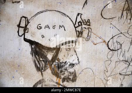 Charcoal Drawing of Head with Motorcycle Helmet on White Wall Stock Photo