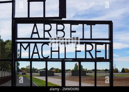 Lettering Arbeit macht frei (Work sets you free) in the entrance building to the prisoners' camp Tower A, Sachsenhausen Concentration Camp Memorial Stock Photo