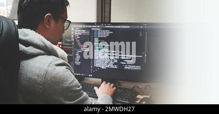 Coder programmers working in office, Programmer analyst writing code - Coder working from home with work on screen computer for learning and developin Stock Photo