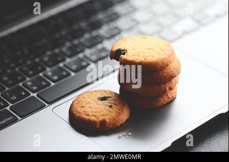 internet cookies, mini cookies on keyboard computer laptop for internet browser cookies concept Stock Photo