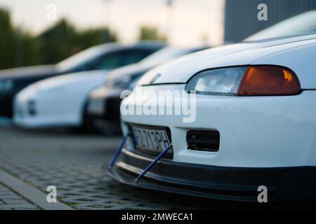 The white Honda Civic V car with tuning for racing parked outdoors during the daytime Stock Photo