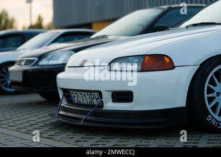 The white Honda Civic V car with tuning for racing parked outdoors during the daytime Stock Photo