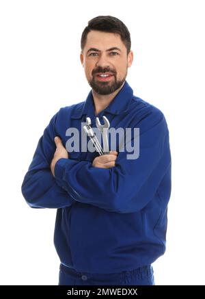 Portrait of professional auto mechanic with wrenches on white background Stock Photo