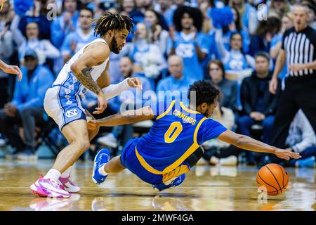 February 1, 2023: Pittsburgh Panthers guard Nelly Cummings (0) falls after the loose ball as North Carolina Tar Heels guard R.J. Davis (4) prepares to go for it during the first half of the ACC basketball matchup at Dean Smith Center in Chapel Hill, NC. (Scott Kinser/CSM) Stock Photo