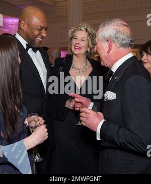 Britain's Prince Charles, right, laughs with actor Colin Salmon as he attends the annual Prince's Trust 'Invest In Futures' reception at The Savoy Hotel in London, Thursday, Feb. 9, 2017, where he met the charity's ambassadors, supporters and beneficiaries. (Geoff Pugh/Pool Photo via AP)