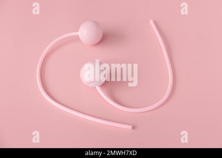 Fitness and healthy sport concept. Pink ropeless jump rope on a pastel pink background. Stock Photo