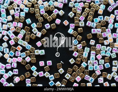 Question and answer concept. Question mark symbol on blackboard with an alphabet beads. Stock Photo