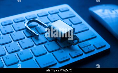 Computer security concept. Unlocked padlock on laptop keyboard.Computer is protected from online cybercrime and hacking Stock Photo