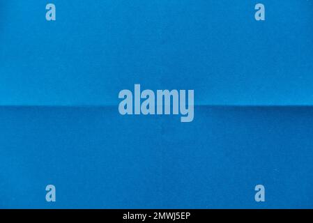 Folded blue paper for background. Stock Photo