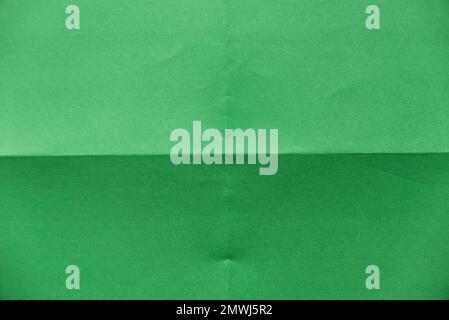Folded green paper for background. Stock Photo
