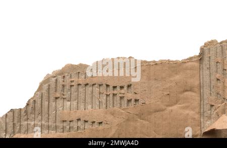 Old textured cardboard sheet with torn edges isolated isolated on white background. Copy space. Stock Photo