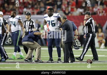 Atlanta Falcons guard Germain Ifedi (74) watches before a