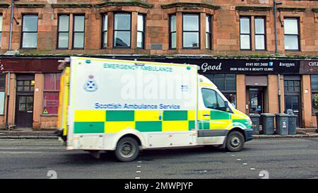 Ambulance rushing to emergency on killbowie road Clydebank Stock Photo
