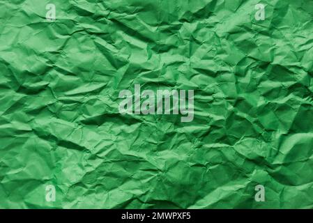 Green crumpled paper for background. Stock Photo