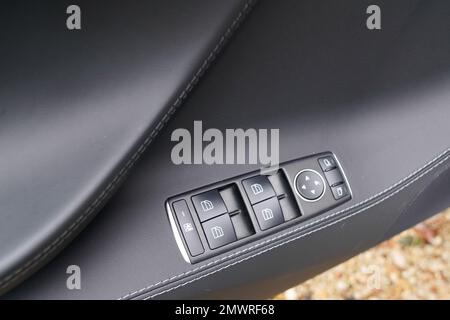 door control panel in a new modern car electric window button Stock Photo