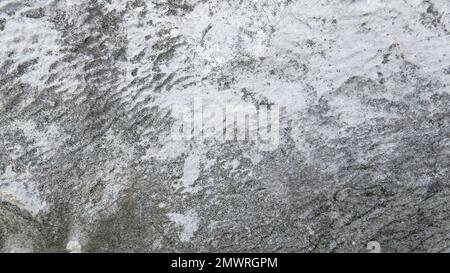 Gray and white rough grainy stone texture background. Stock Photo
