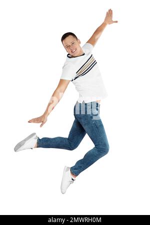 Handsome young man jumping on red background Stock Photo