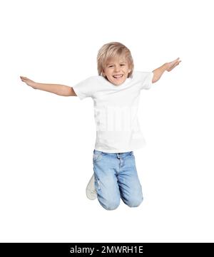 Happy little boy jumping on light grey background Stock Photo