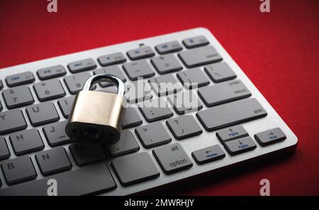 Computer security concept. Locked padlock on laptop keyboard.Computer is protected from online cybercrime and hacking Stock Photo