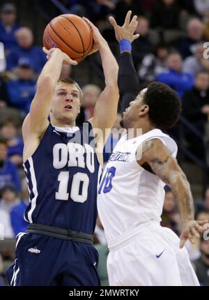 Oral Roberts' Jalen Bradley (10) grabs a rebound over New Mexico's Sam ...