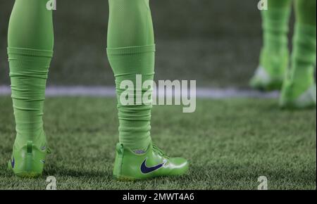 Cleats and socks from the Seattle Seahawks color rush uniform are shown  before an NFL football game against the Los Angeles Rams, Thursday, Dec.  15, 2016, in Seattle. (AP Photo/Scott Eklund Stock