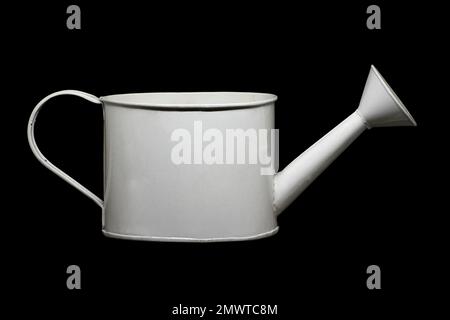 Image of a small watering can for watering indoor flowers in white Stock Photo
