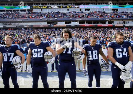 Tennessee Titans and Denver Broncos players join together in a Christmas  prayer on the 50 yard line following an NFL football game on December 25,  2004 at The Coliseum in Nashville, TN.