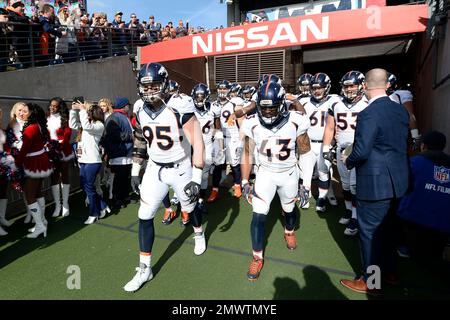 Tennessee Titans and Denver Broncos players join together in a Christmas  prayer on the 50 yard line following an NFL football game on December 25,  2004 at The Coliseum in Nashville, TN.