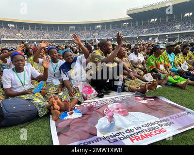 02 February 2023, Democratic Republic of the Congo, Kinshasa: Numerous believers are waiting in the soccer stadium 'Martyrs Stadium' for the arrival of Pope Francis. The pope is visiting Congo this week and will travel on to South Sudan on Feb. 3, 2023. Photo: Manuel Schwarz/dpa Stock Photo