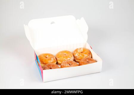Glazed donuts in box unbranded packaging template mock up Stock Photo